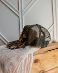 Camo western snapback cap with 5-panel design and embroidered cowboy logo