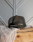 Camouflage western cap with rugged camo print and cowboy embroidery