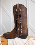 Leopard cowboy boot tassel styled on Ariat boots, side view