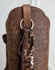 Leopard print velvet cowboy boot tassel, zoomed detail