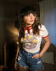 white 'Cowboy Take Me Away' ringer tee with a vintage western graphic