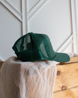 Forest green western snapback cap with pink embroidery and mesh back
