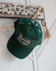 Green Howdy Darlin' trucker cap with pink embroidery, three-quarter view