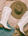 White cowgirl and western boots