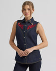 Model wearing Wrangler x Lainey Wilson embroidered sleeveless denim shirt, front view