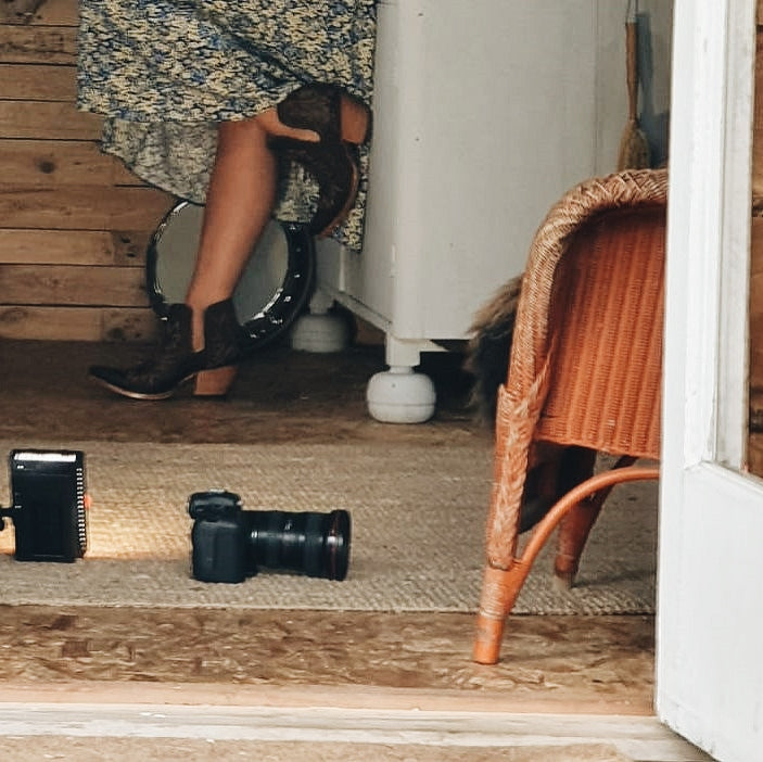 Dixon cowboy booties, western style inside log cabin