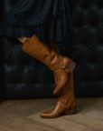 Tan cowboy boots, long and short