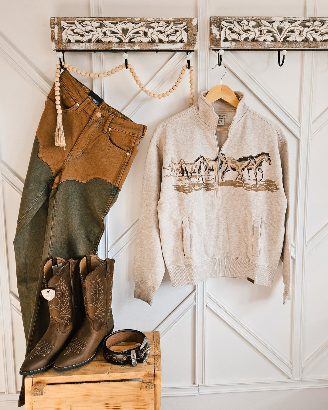 Wrangler x Lainey Wilson brown chap jeans styled with an Ariat horse print sweatshirt