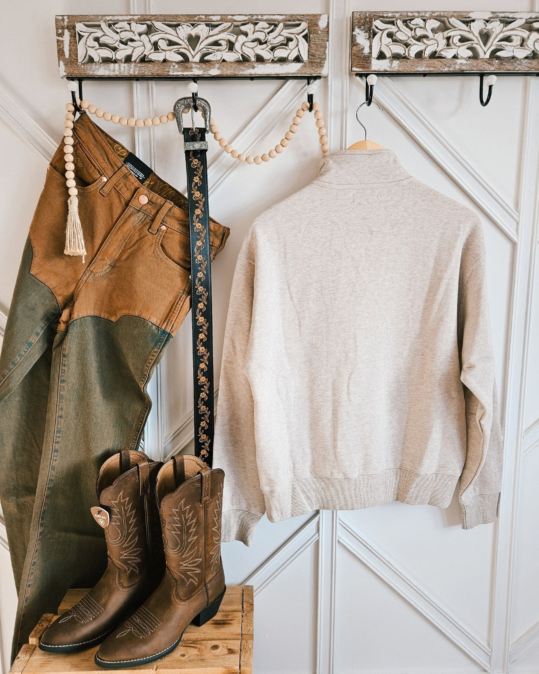 Back view of the Ariat Running Wild half-zip sweatshirt styled in a Western outfit