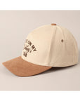 cream and tan western slogan cap