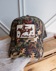 Camo Cowboys Club trucker cap with premium embroidered western patch
