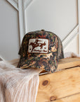 Camouflage cowboy trucker cap with snapback adjuster and mesh panel