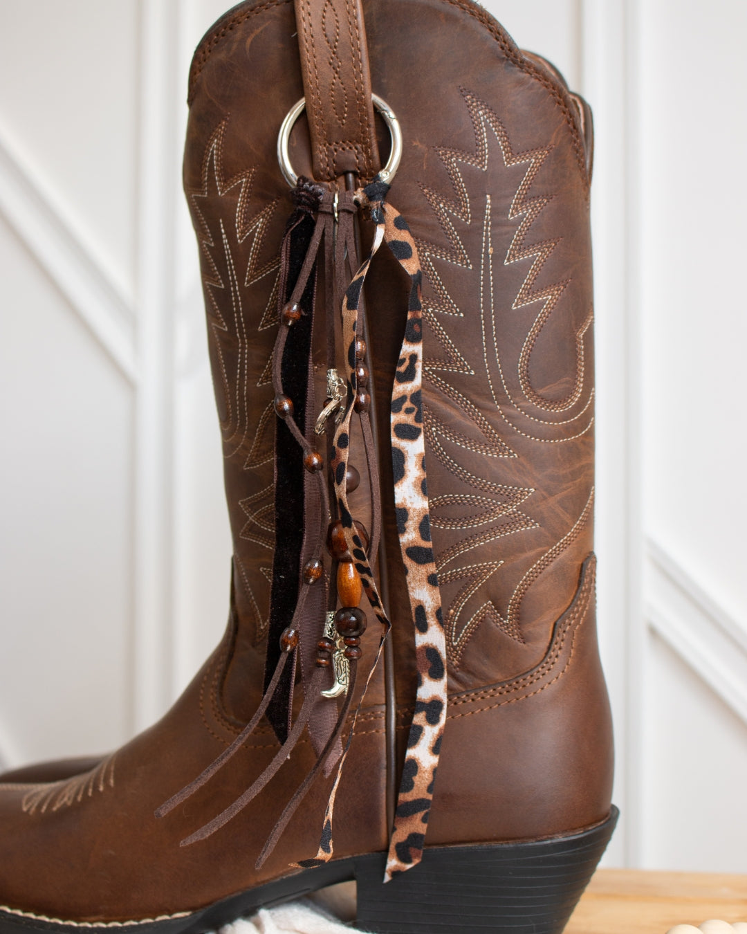 Leopard cowboy boot tassel attached to Ariat boots
