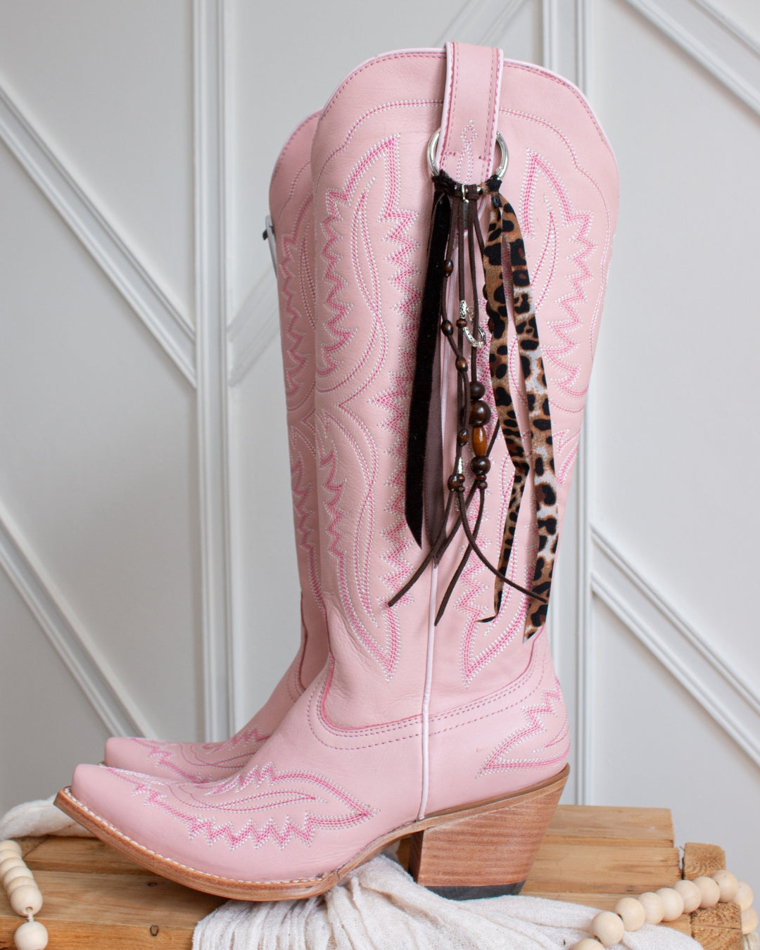 Handcrafted leopard print cowboy boot tassel accessory