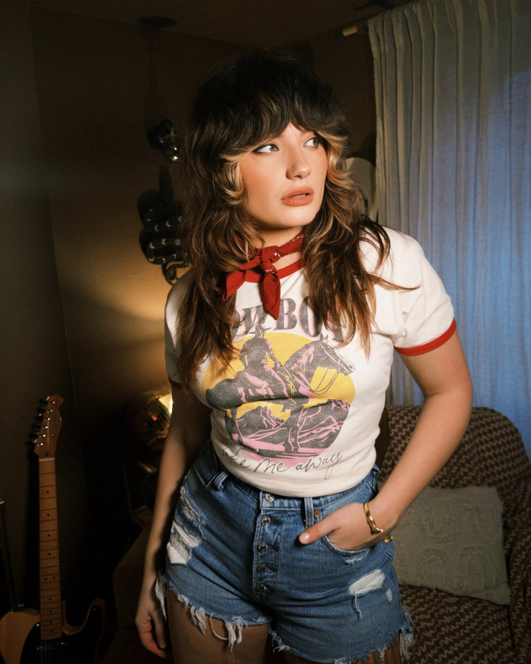 white 'Cowboy Take Me Away' ringer tee with a vintage western graphic