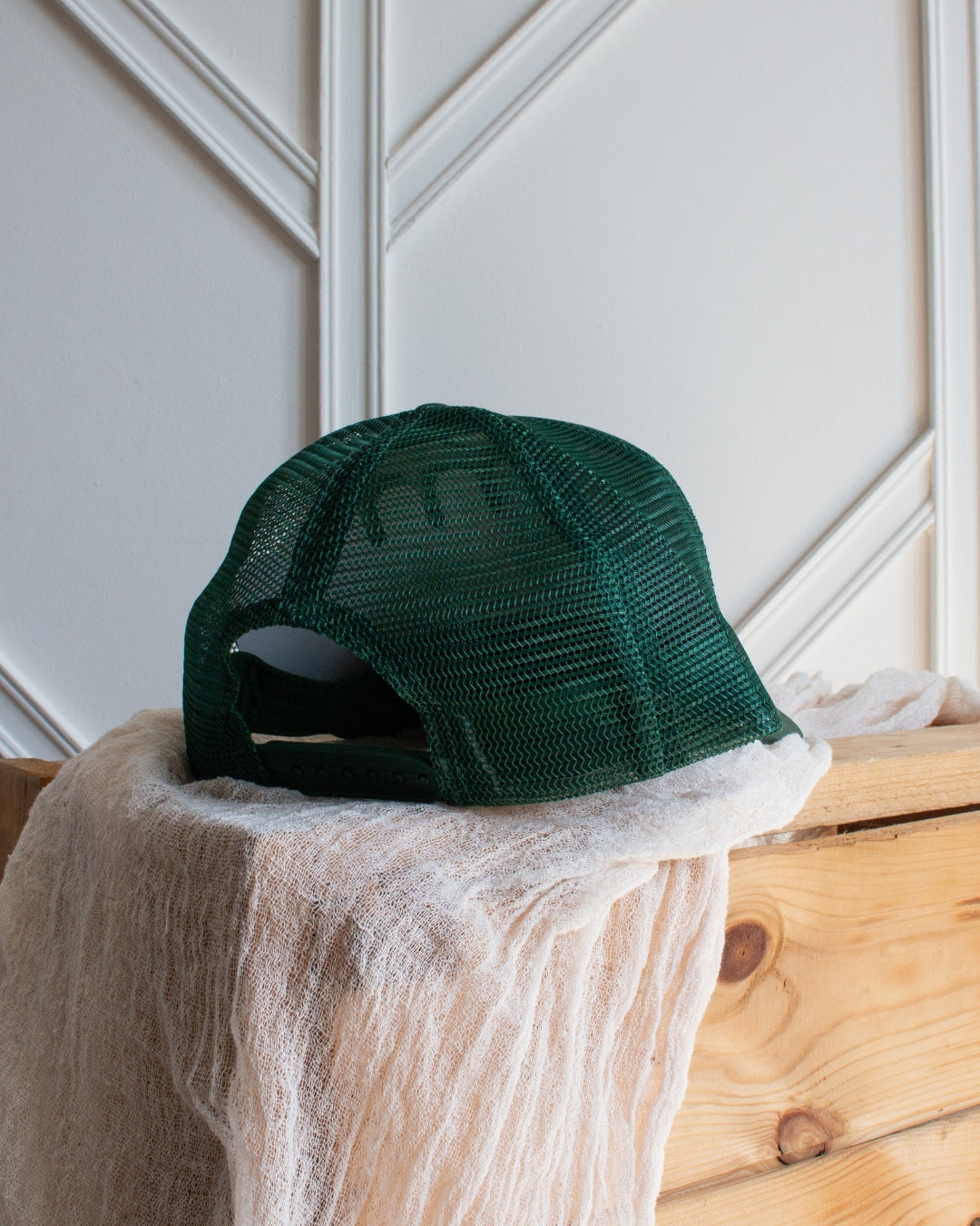 Dark green western trucker cap with vibrant pink Howdy Darlin' embroidery detail
