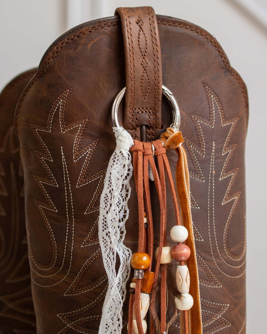 Desert Wanderer lace cowboy boot tassel, close-up detail