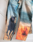 High-rise horse print barrel jeans with 30-inch inseam and button fly