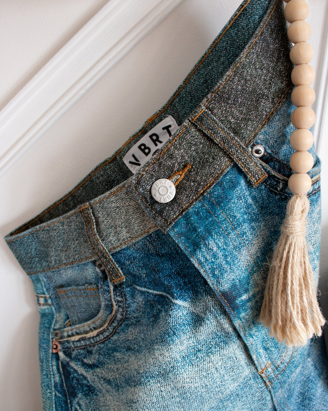 Horse print barrel jeans front detail showing 5-pocket design and zip fly