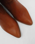 Tan pointed toe cowboy boots