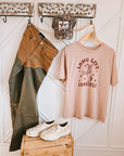 Pink "Long Live Cowgirls" graphic tee with relaxed unisex fit and rodeo-inspired print