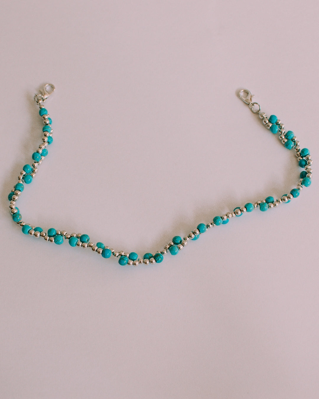 Turquoise stone cap chain with authentic bead design, close-up