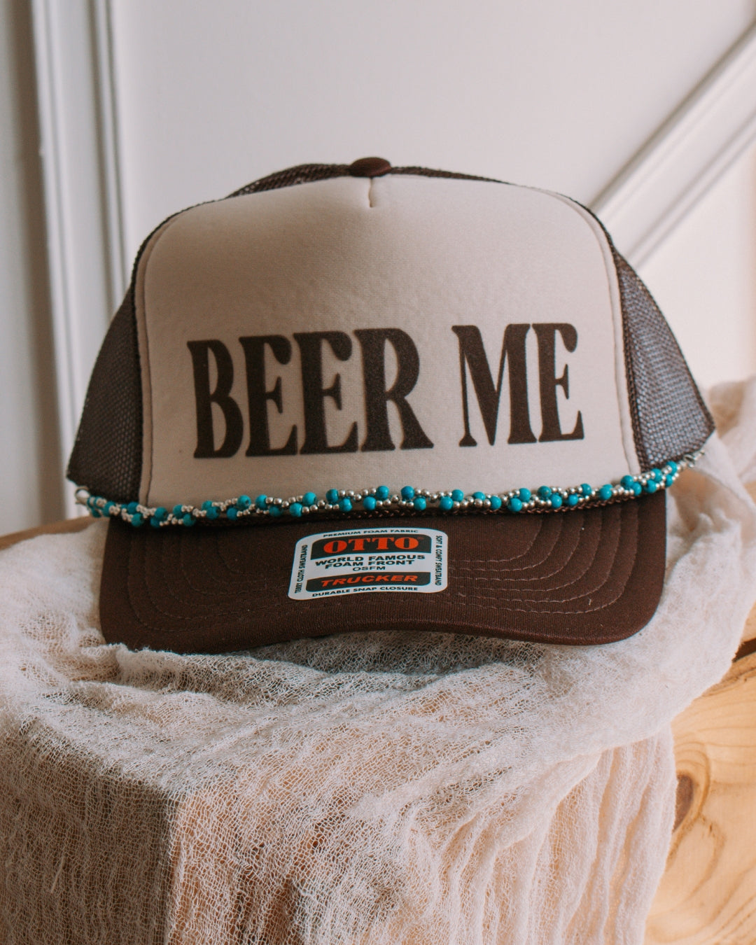 Turquoise stone western cap chain accessory styled on a trucker cap