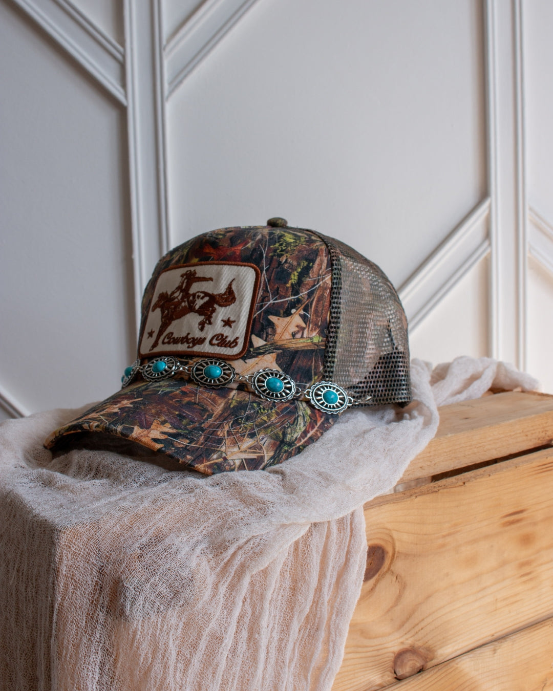 Turquoise western trucker cap chain accessory with engraved concho detail