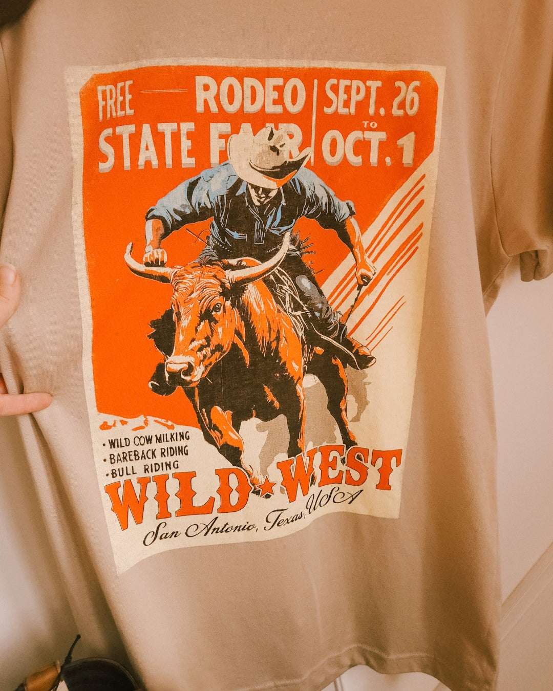 Close-up of the vintage-inspired rodeo cowboy graphic on the Wild West tee