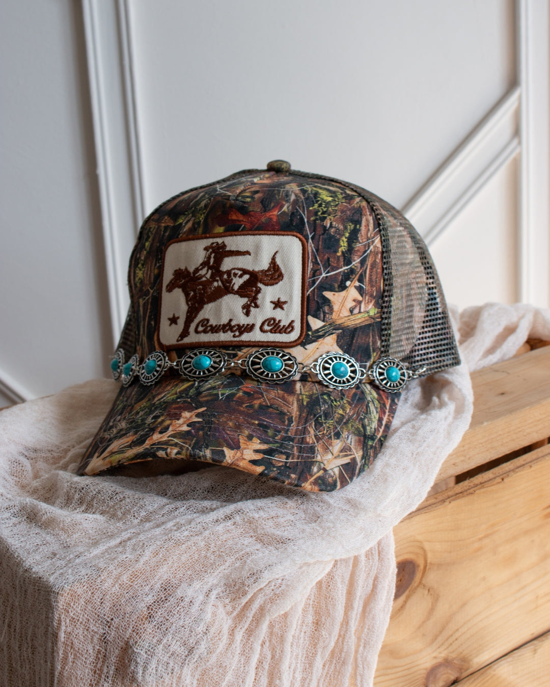 Western concho cap chain with turquoise stone and silver accents, styled on cap