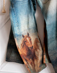 Western horse print barrel jeans showing statement graphic and barrel leg fit
