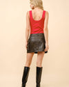 Back view of Ribbed Western Buckle Red Bodysuit showing ribbed texture and adjustable embellished buckle straps in studio setting