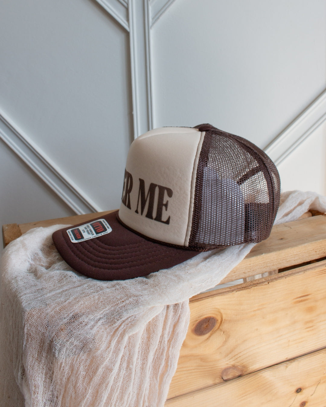 Brown western slogan trucker cap with bold Beer Me graphic