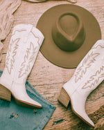 White cowgirl and western boots