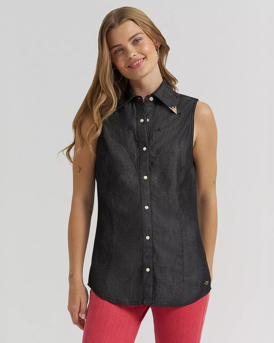 Model wearing Wrangler x Lainey Wilson black denim sleeveless western shirt