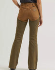 Rear view of Wrangler x Lainey Wilson brown chap jeans showing back pockets, Wrangler patch and curved chap-style panel seams