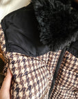 Close-up of the houndstooth pattern fabric on the Wrangler Western puffer jacket