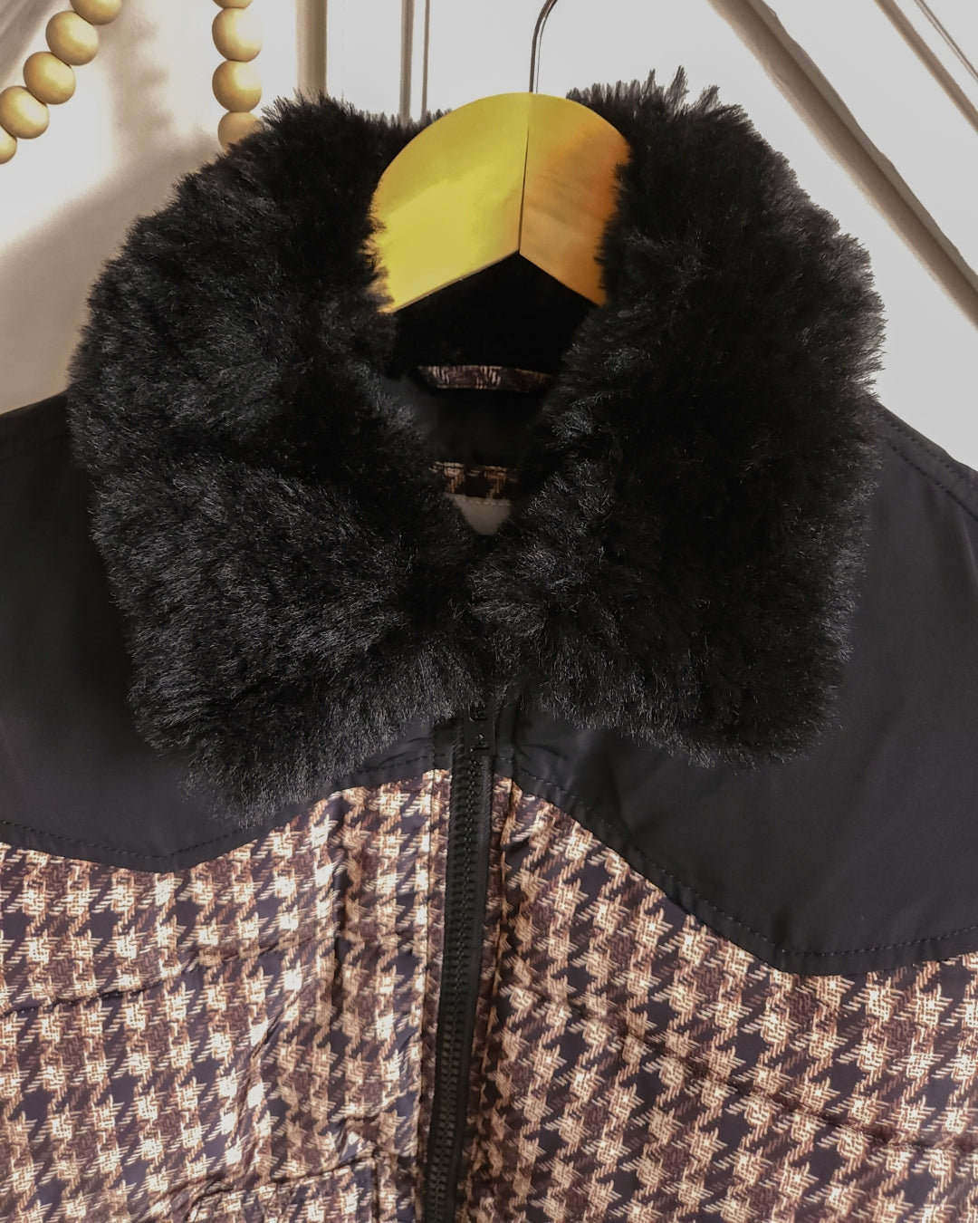 Zoomed-in view of the plush black faux fur collar on the Wrangler Western puffer jacket