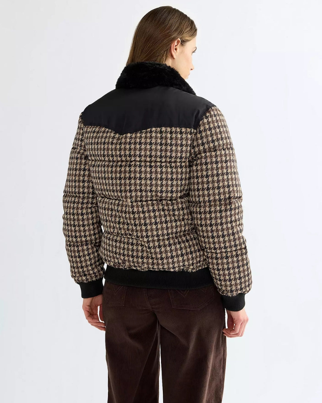 Back view of the Wrangler Western houndstooth puffer jacket showing the black pointed Western yoke and ribbed hem