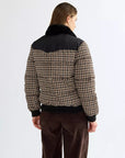 Back view of the Wrangler Western houndstooth puffer jacket showing the black pointed Western yoke and ribbed hem