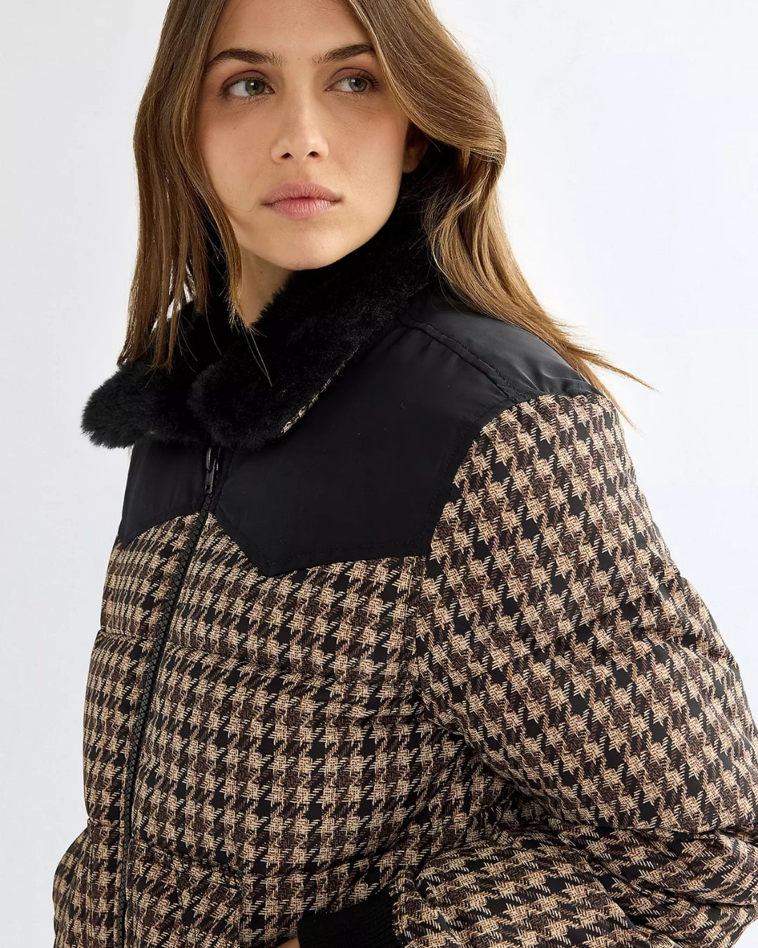 Close-up of the Wrangler Western houndstooth puffer jacket showing the plush black faux fur collar and Western yoke detail