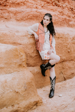 Festival fashion with black cowgirl boots