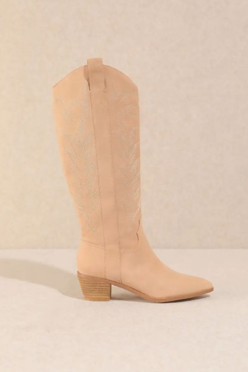Cowboy boots in a soft pink